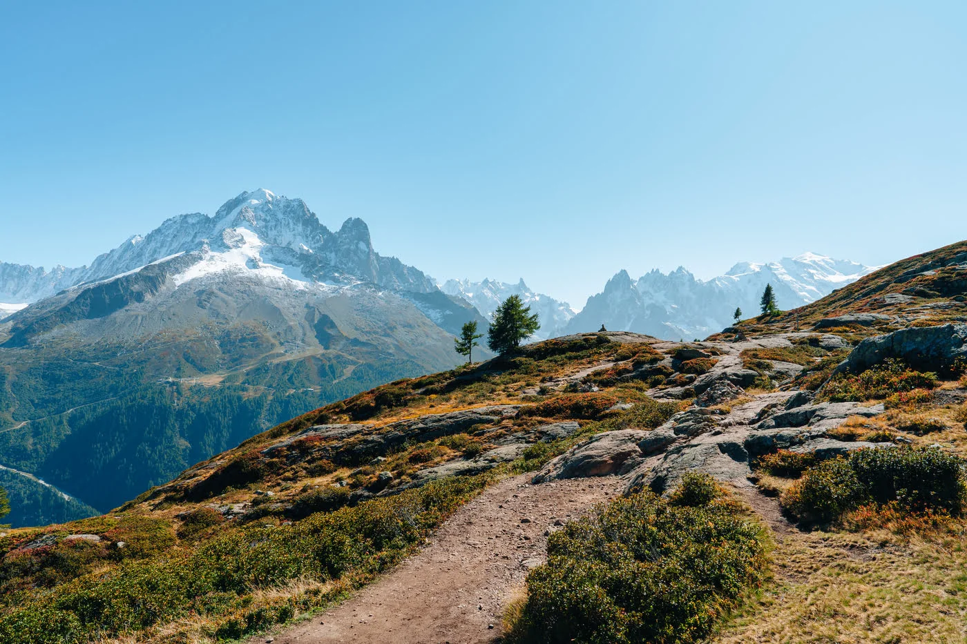 Wide mountain trail landscape under soft daylight