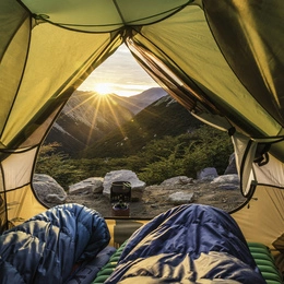Camping table with map, lantern, and outdoor notebook